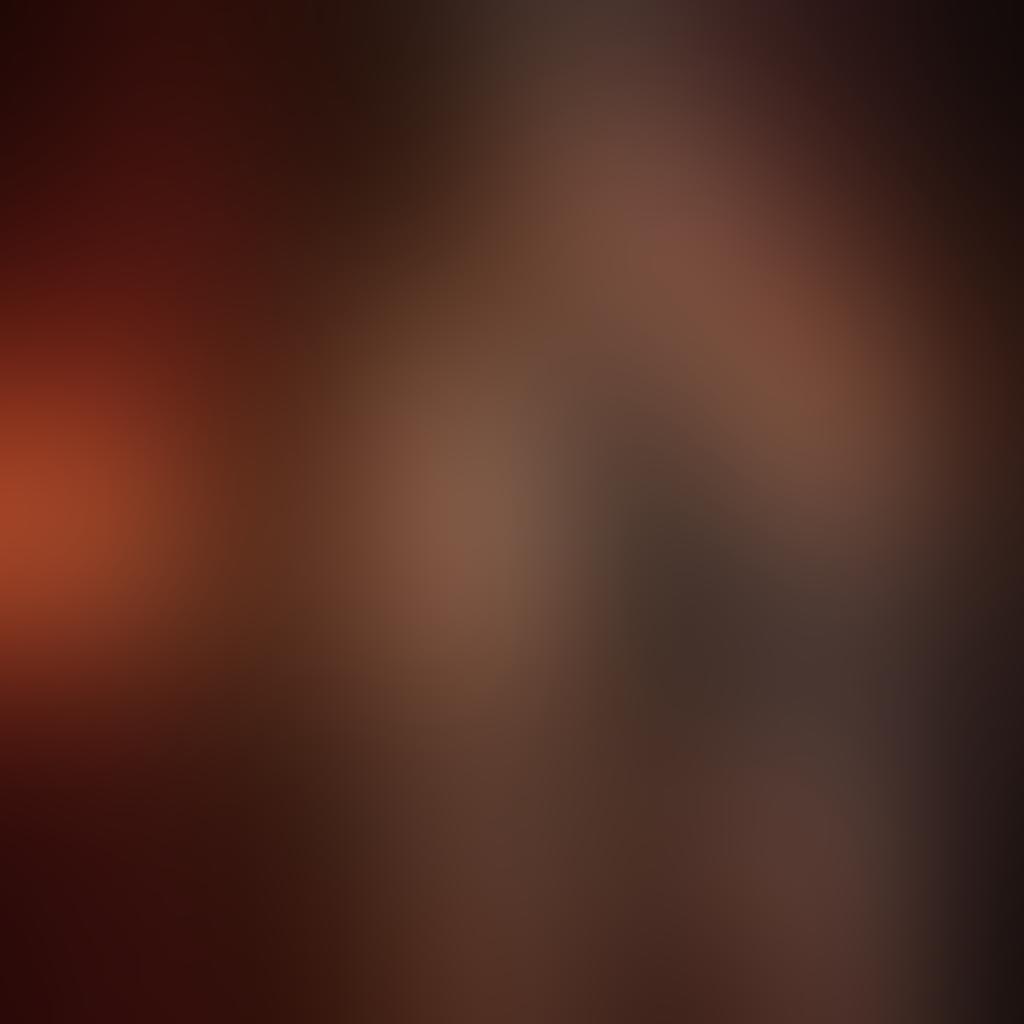 A dimly lit room filled with various BDSM equipment like whips, cuffs, and candles, showcasing elements of intimacy and trust. In the foreground, a close-up of a hand delicately touching a leather harness, symbolizing consent. Soft shadows play across the walls, enhancing the mood of exploration and safety. The color palette includes deep reds and blacks to evoke passion and mystery. sensual art style. dramatic lighting. intimate atmosphere.